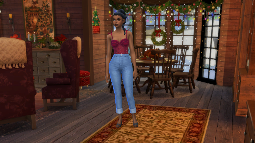 Un sim con pantalones vaqueros azules de talle alto y un body de corsé rojo con el pelo recogido en una trenza. Este sim está de pie en una habitación decorada festivamente para Navidad.