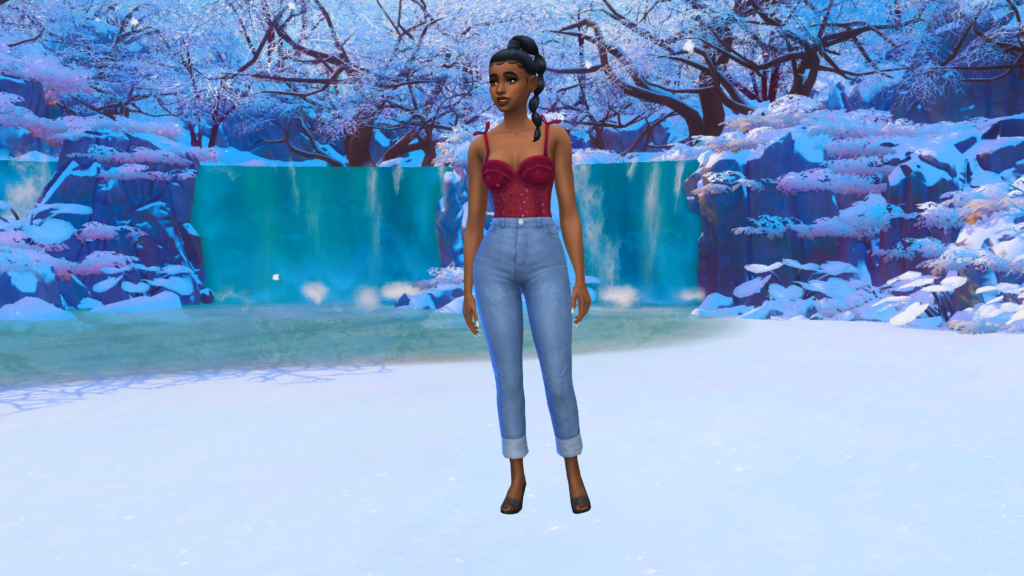 Un sim con pantalones vaqueros azules de talle alto y un corsé rojo con el pelo recogido en una trenza. Este sim está de pie en una zona nevada de Mt. Komorebi en Los Sims 4 como fondo de CAS.