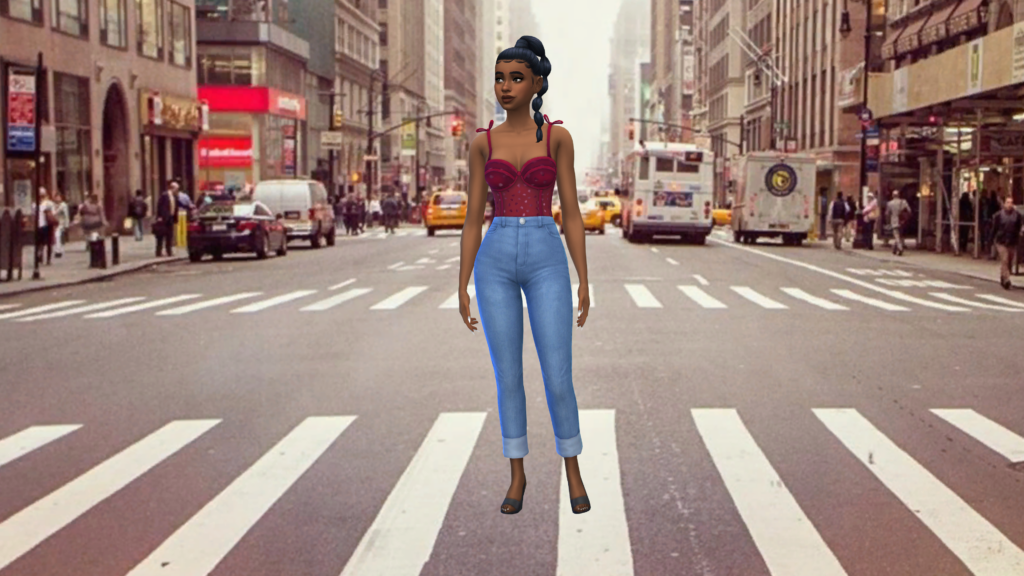 Un sim con vaqueros azules de cintura alta y un corpiño rojo, con el pelo recogido en una trenza. El sim está parado en medio de un cruce de calles en una gran ciudad.