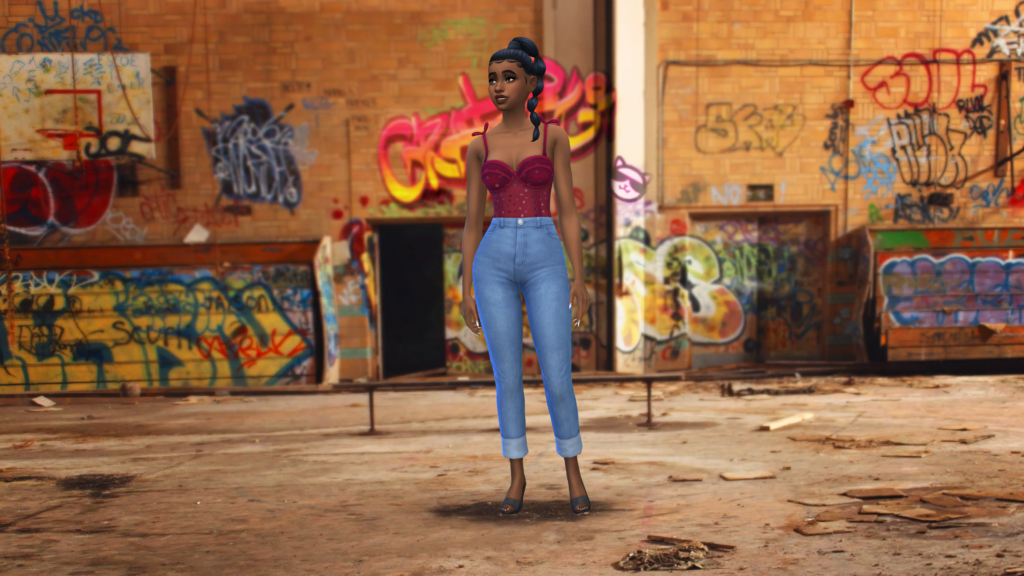 Un sim con pantalones vaqueros de cintura alta y un body corset rojo con el cabello trenzado. Este sim está parado en un callejón que tiene graffiti y basura por todas partes.
