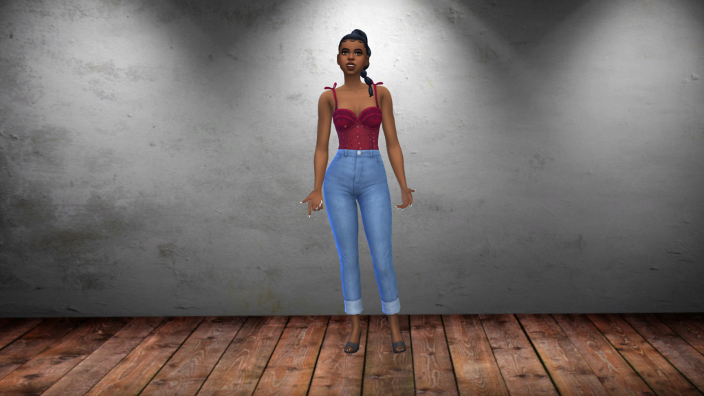 Un sim con pantalones vaqueros de talle alto azules y un body corsé rojo con el pelo recogido en una trenza. El fondo de pantalla CAS de Los Sims 4 para este sim es un suelo de tablones de madera y una pared gris de aspecto grunge.