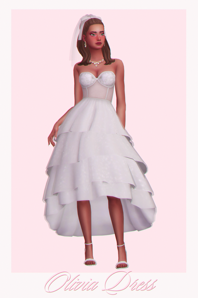 Un vestido de novia con una falda con capas y un top de corsé