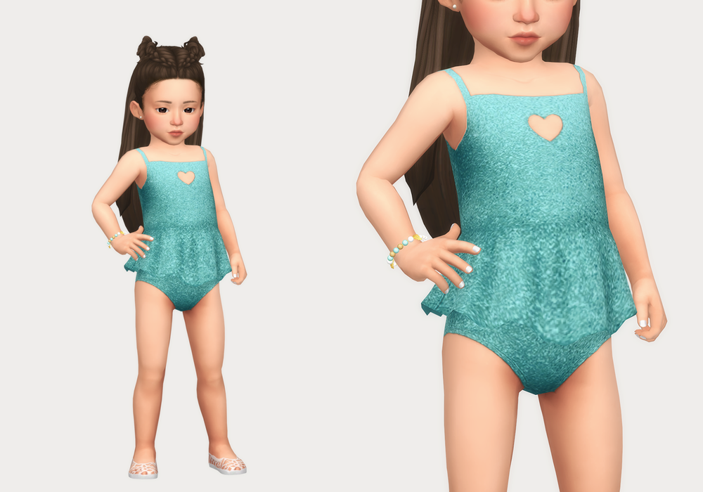 Una niña pequeña de Los Sims 4 vistiendo un traje de baño de color turquesa con brillo y un pequeño corazón recortado en el pecho.