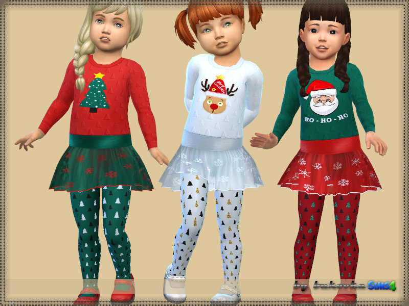 Tres adorables bebés vistiendo un vestido de manga larga para Navidad que tiene un tutú y medias cubiertas de árboles de Navidad y copos de nieve