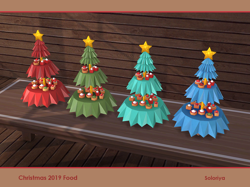Cuatro árboles de Navidad con estrellas amarillas brillantes en la parte superior. Hay dos recortes en el árbol para crear una capa para los postres.