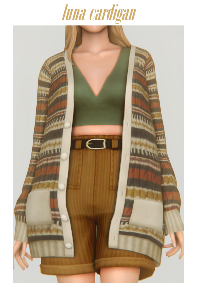 Un sim que lleva puesto un top corto verde con unos pantalones cortos marrones de talle alto, también lleva un cardigan extragrande con estampado.