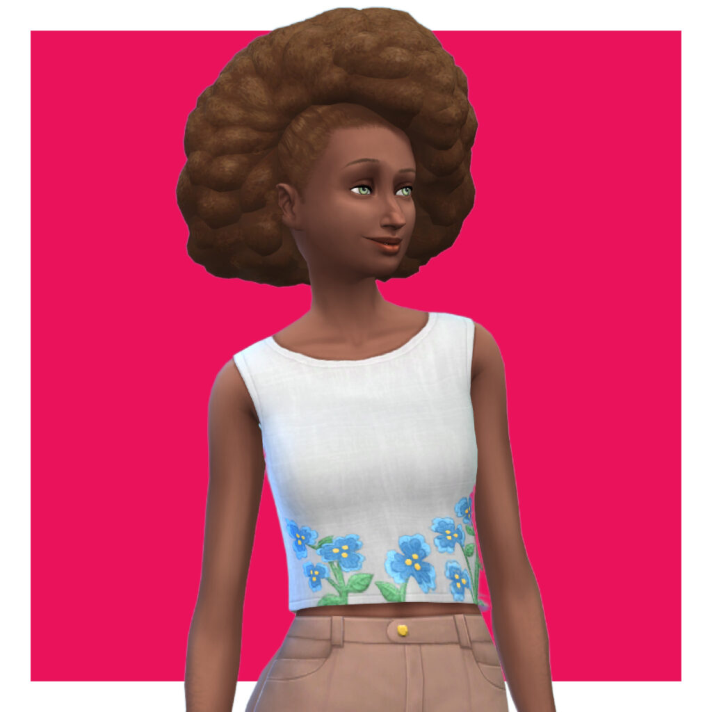 Una sim que lleva pantalones khaki con una camiseta blanca. Esta camiseta tiene mangas laterales y flores bordadas en la parte inferior. Su cabello es un afro voluminoso.
