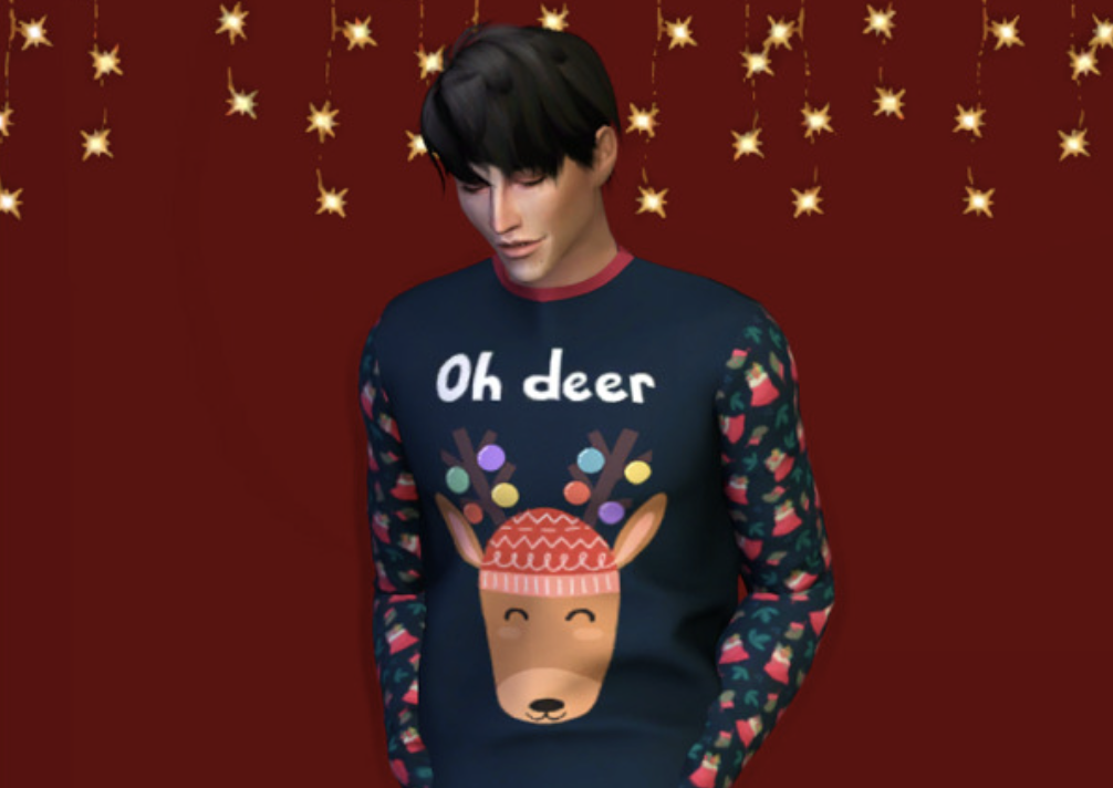 Un Sim masculino con cabello negro mirando hacia abajo. Este Sim lleva una camiseta de pijama que dice Oh Deer y tiene un ciervo con un sombrero de Navidad