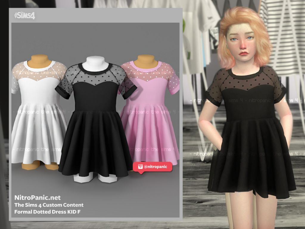 Un vestido formal que tiene un escote en forma de corazón con un encaje de lunares encima.