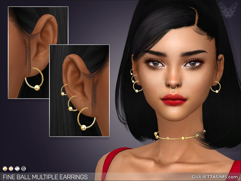Un sim de Los Sims 4 con cabello negro en una cola de caballo alta con un flequillo de lado. Llevan una camiseta de tirantes roja brillante con pendientes de CC dorados.