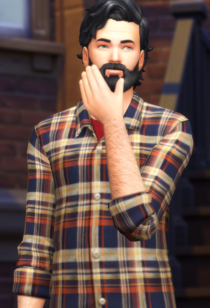 Un Sim masculino de Los Sims 4 que lleva una camisa a cuadros naranja, azul y amarilla como su ropa personalizada de Sim masculino.