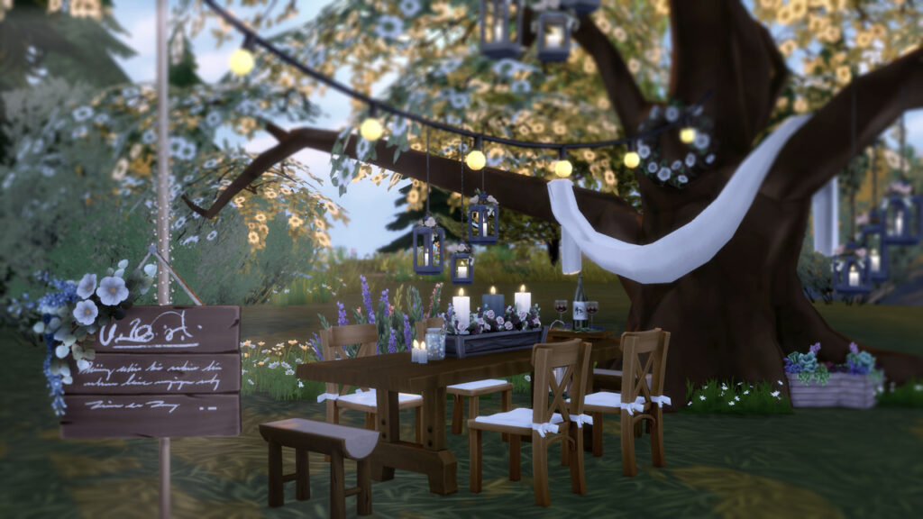 Una captura de pantalla de Los Sims 4 que muestra un gran árbol en el fondo con tela colgada en él. Hay una mesa cubierta de decoraciones de boda CC frente a él.