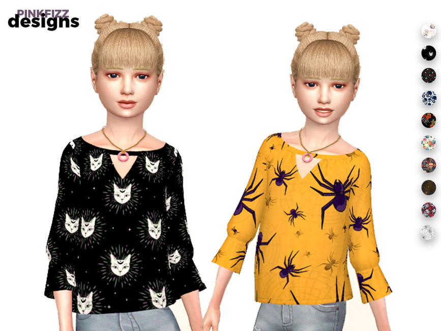 dos niños en blusas de Halloween