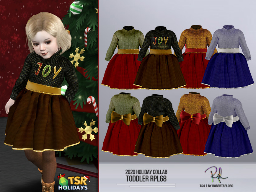 Un niño pequeño de cabello rubio en Los Sims 4 que lleva puesto un vestido navideño de CC que dice JOY en el pecho con un gran lazo en la parte trasera