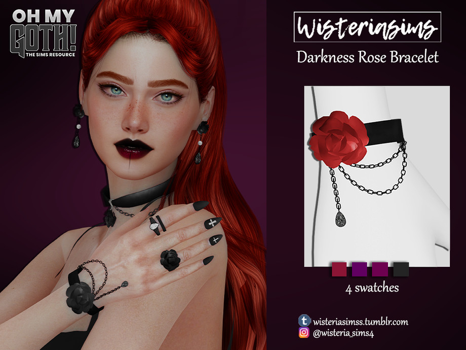 Un sim con cabello rojo brillante y ojos azules claros. Lleva puesto un lápiz labial rojo oscuro con efecto degradado y una camiseta negra sin mangas. Sus uñas están pintadas de negro con cruces como diseño y lleva muchas joyas negras.